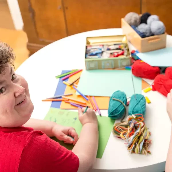 Group of disabled friends in knitting class